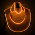 Orange rhinestoned LED cowboy hat in dark setting - Handcrafted illuminated festival hat for holiday galas, fashion week after-parties, and premium nightlife venues