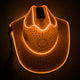 Orange rhinestoned LED cowboy hat in dark setting - Handcrafted illuminated festival hat for holiday galas, fashion week after-parties, and premium nightlife venues