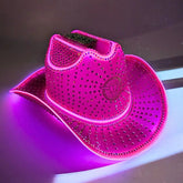 Hot pink rhinestone LED cowboy hat glowing with lit crystal brim, Pink rhinestoned LED cowboy hat with 3,000+ crystals, Luxury festival headpiece for Coachella, EDM raves, TikTok content creators, and country music awards, led cowboy hat, neon rancher hat, Neon Cowboys