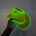Hand holding green LED cowboy hat in dark setting - Side view of acid green illuminated western hat showing glowing trim