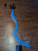 EL wire strand on wooden surface - 34-inch cool white sewable light strand showing flexible wire construction for DIY projects