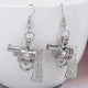 Silver Pistol Earrings in Daylight - Glowing View of Gun Shaped Jewelry - Lightweight Metal Statement Earrings for Everyday Edgy Style