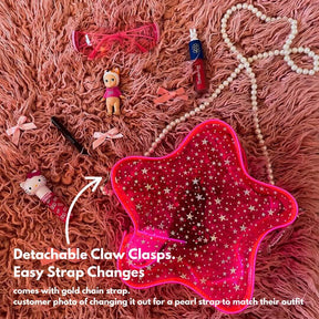 Light up LED Pink star crossbody bag with detachable claw clasps shown with pearl chain strap - customizable clear bag policy concert purse with interchangeable straps for festivals, parties and events