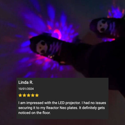 Customer review with five-star rating of purple star projector lights creating colorful patterns during nighttime roller skating sessions and disco parties