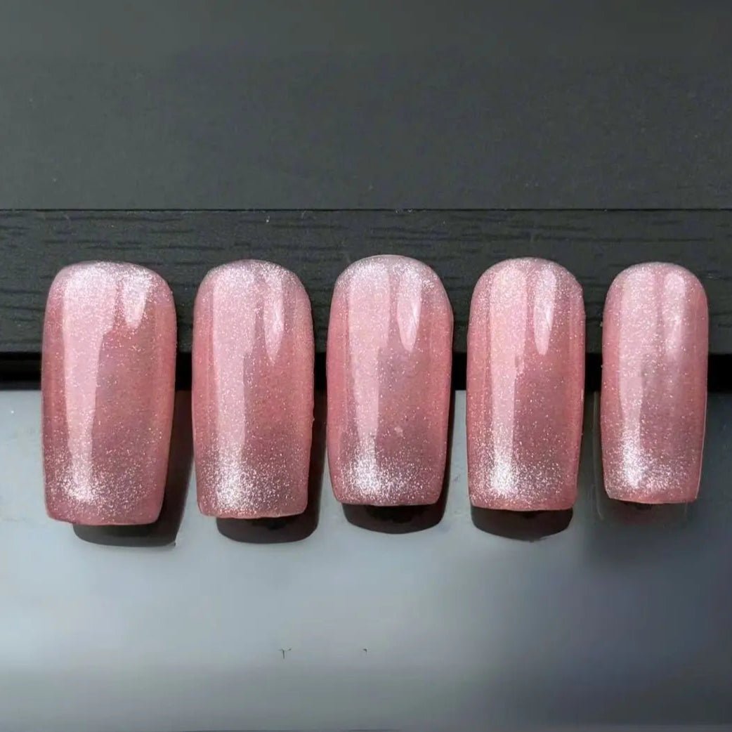 five hand press on nail set in pink with silver glitter detail and light up led nail feature