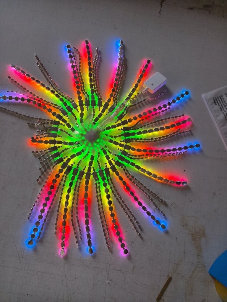 The small LED controller next to the headpiece, lit rainbow